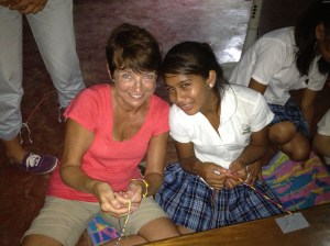 Sherri Joyce and her buddy making bracelets