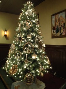 This  is a Chrismon tree that is full of Christian symbols.  It is traditionally placed in the narthex of our Historic  Sanctuary each year; provided by a family of many generations.  